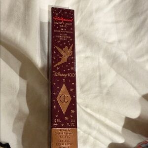 Disney 100 Hollywood Beauty Light Wand in likely pink or gold. Highlighter blush